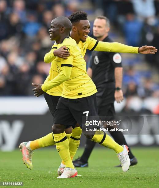 Ngolo Kante celebrates with Callum Hudson-Odoi of Chelsea after scoring their team's second goal during the Premier League match between Leicester...