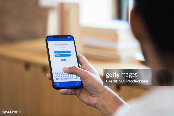 unrecognizable man uses banking app - log in stock pictures, royalty-free photos & images