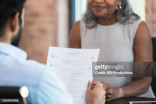 businessman interviews job candidate - cv bildbanksfoton och bilder