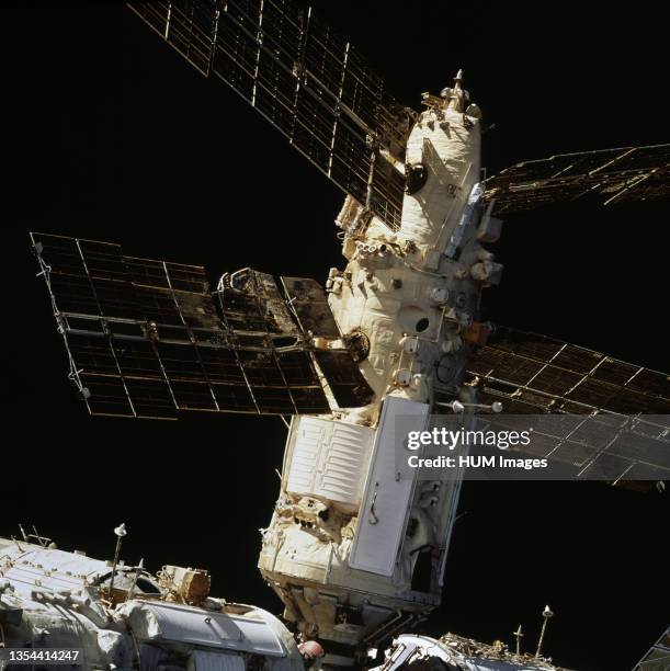 70mm view of Russia’s Mir Space Station’s Spektr Module shows the backside of a solar array panel and damage incurred by the impact of a Russian...