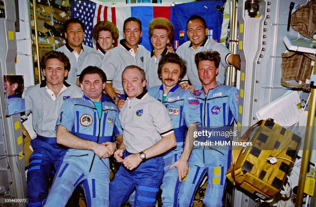 Crewmembers from Mir-23 and STS-84 assemble for a group portrait onboard the Spacehab Double Module, as they tie a record (ten) for number of persons aboard a single orbiting spacecraft at one time ca. 1997