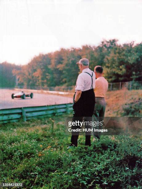 Monza, Autodromo Nazionale, 1962. Enzo Ferrari, founder of the Scuderia Ferrari, along the circuit while observing one of his cars during testing ca....