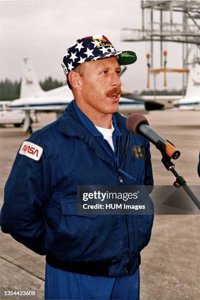 Mission Commander Kenneth D. Bowersox greets media representatives after arrival at KSC's Shuttle Landing Facility. Bowersox and the other six...