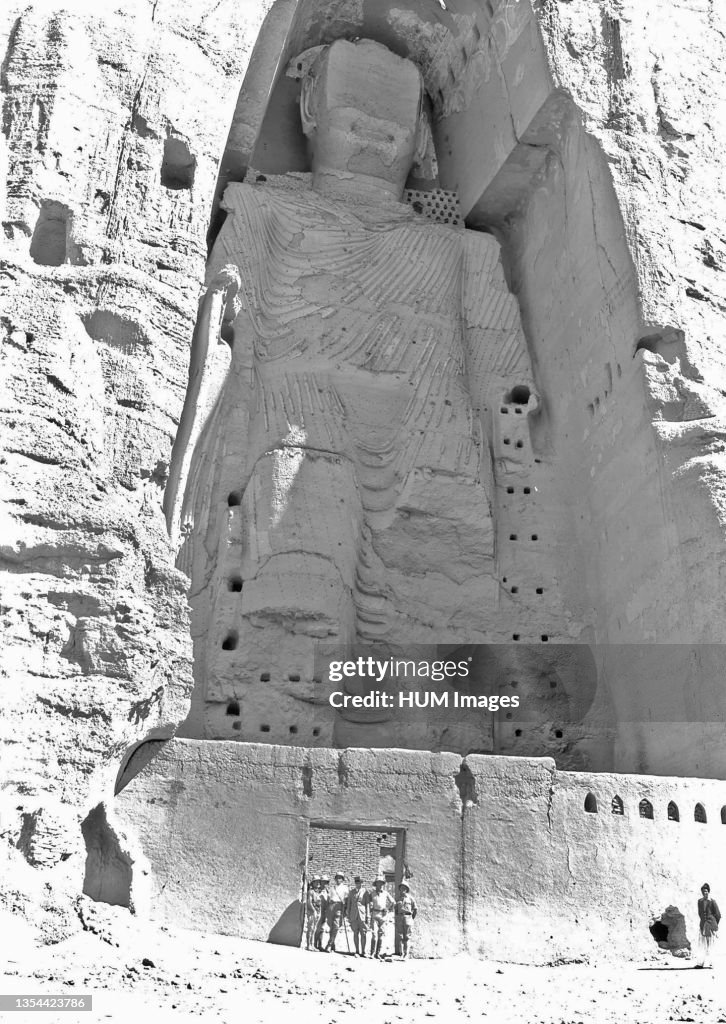 View of the taller Bamiyan Buddha statue, known as Salsal, standing in his giant niche ca. 1928