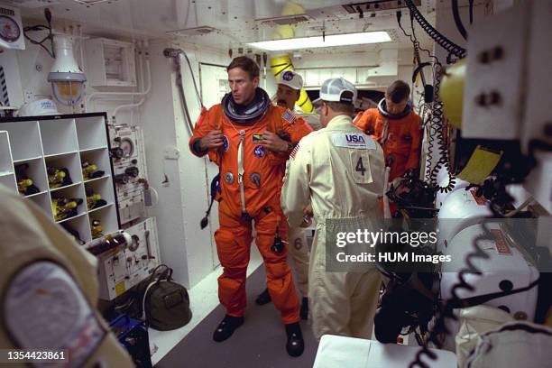 Mission Specialist Michael L. Gernhardt prepares to enter the Space Shuttle Columbia at Launch Pad 39A in preparation for launch. He first flew in...