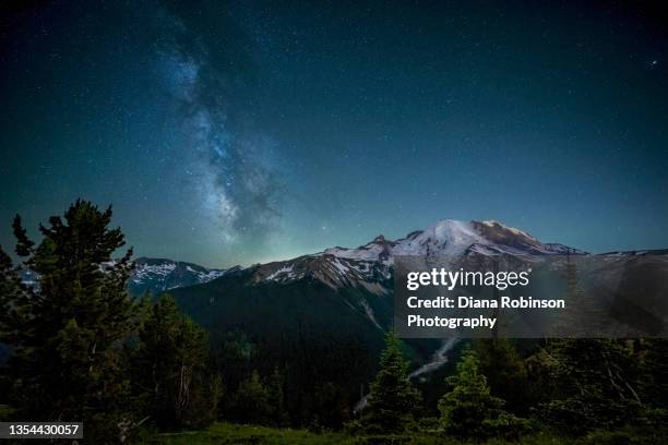 the milky way over mt. rainier with the white river and the emmons glacier from the silver forest trail ridgeline, washington state - snowcapped mountain stock pictures, royalty-free photos & images