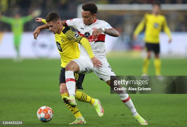 Thorgan Hazard of Borussia Dortmund is challenged by Roberto Massimo of VfB Stuttgart during the Bundesliga match between Borussia Dortmund and VfB...