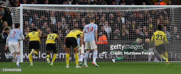 David de Gea of Manchester United saves a second penalty from Ismaila Sarr of Watford during the Premier League match between Watford and Manchester...