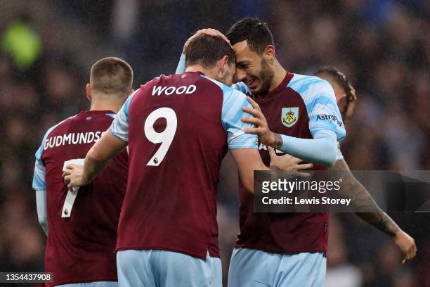 Chris Wood of Burnley celebrates with teammate Dwight McNeil after scoring their team's second goal during the Premier League match between Burnley...