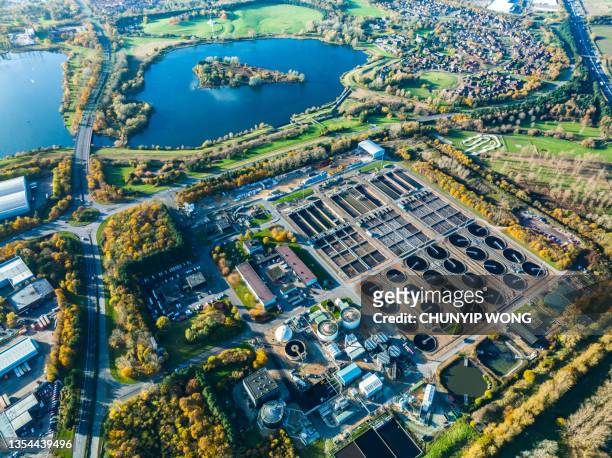 aerial photo of purification tanks of modern wastewater treatment plant - sewage stockfoto's en -beelden