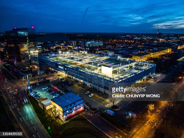drone aerial view of parking lot at night - milton keynes stock pictures, royalty-free photos & images