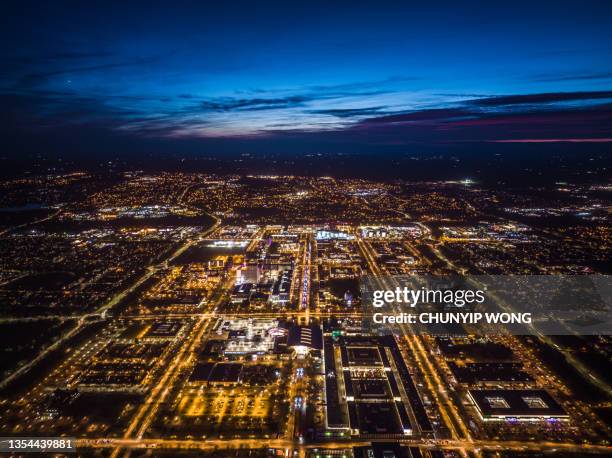 drone view of milton keynes central at night - milton keynes stockfoto's en -beelden