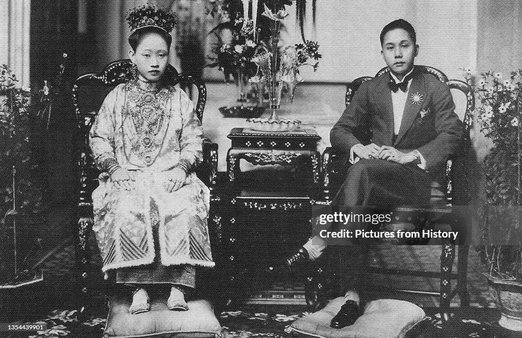 Singapore: A Peranakan bride and groom, early 20th century