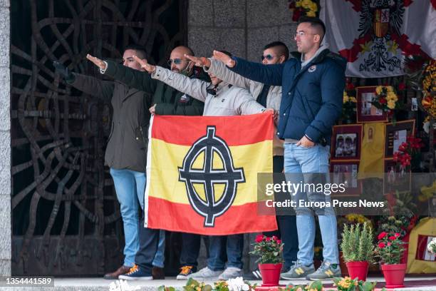 Several men perform the fascist salute or 'Seig Heil' next to the pantheon of the Franco Family, in the cemetery of Mingorrubio, on 20 November, 2021...