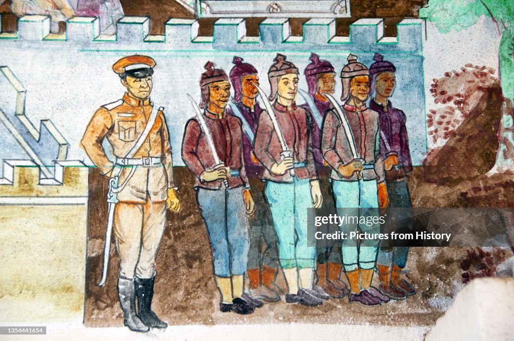 Thailand: Mural of soldiers in traditional uniform with an officer in modern uniform on the front of the viharn at Wat Si Khun Mueang, Chiang Khan, Loei Province
