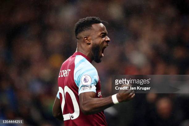 Maxwel Cornet of Burnley celebrates after scoring their team's third goal during the Premier League match between Burnley and Crystal Palace at Turf...