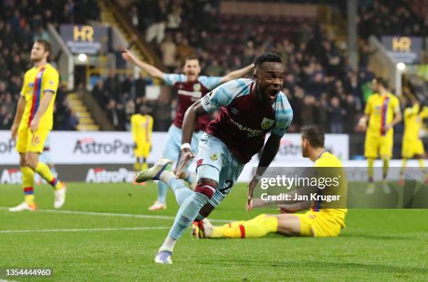 Maxwel Cornet of Burnley celebrates after scoring their team's third goal during the Premier League match between Burnley and Crystal Palace at Turf...