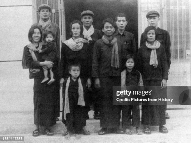 Tuol Sleng Prison: Senior Khmer Rouge cadre pose with their wives and children. Back row, first left, is Mam Nay, senior S 21 interrogator; back row...