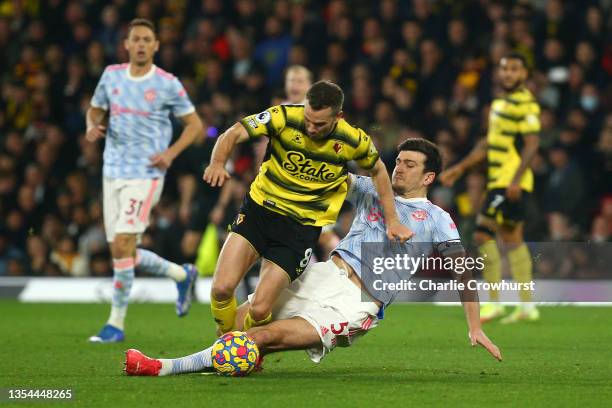 Tom Cleverley of Watford FC is fouled by Harry Maguire of Manchester United leading to a second yellow card and red card during the Premier League...