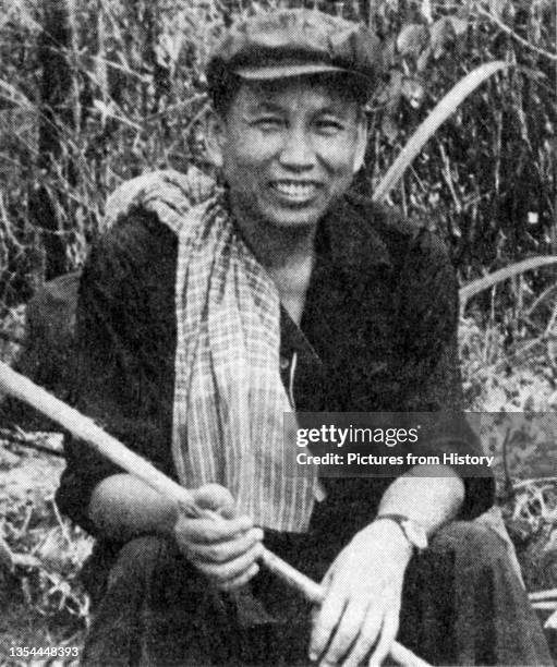 In a posed propaganda photograph, Pol Pot, recently driven from power by the Vietnamese, sends a message to Hanoi and to the outside world: 'We're...