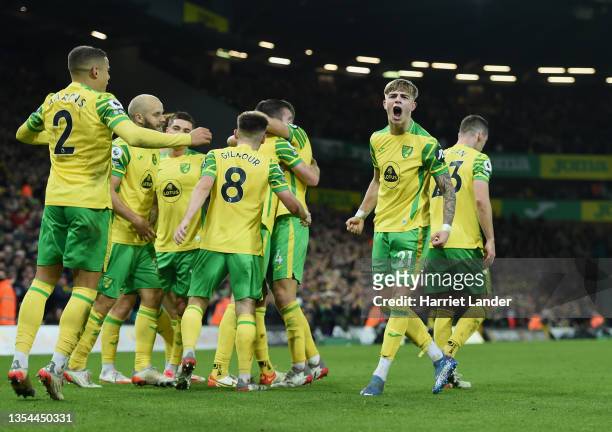Brandon Williams and teammates celebrate as Grant Hanley of Norwich City celebrates after scoring their team's second goal during the Premier League...