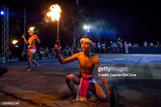 Thai fire dancers perform at a Yee Peng festival on November 20, 2021 inLamphun, Thailand. The Gassan Panorama Golf Course in northern Thailand hosts...