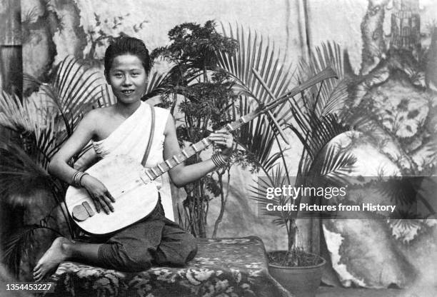 Chapei dong veng' is a Khmer two-stringed, long-necked traditional guitar. The girl in the picture would most likely have played to the court of King...