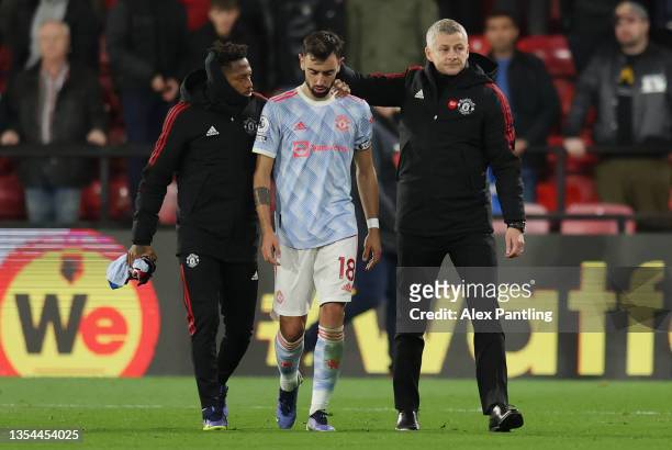 Ole Gunnar Solskjaer, Manager of Manchester United interacts with Bruno Fernandes of Manchester United following the Premier League match between...