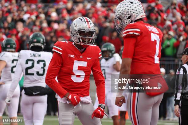 Garrett Wilson of the Ohio State Buckeyes celebrates a first quarter touchdown with C.J. Stroud while playing Michigan State at Ohio Stadium on...