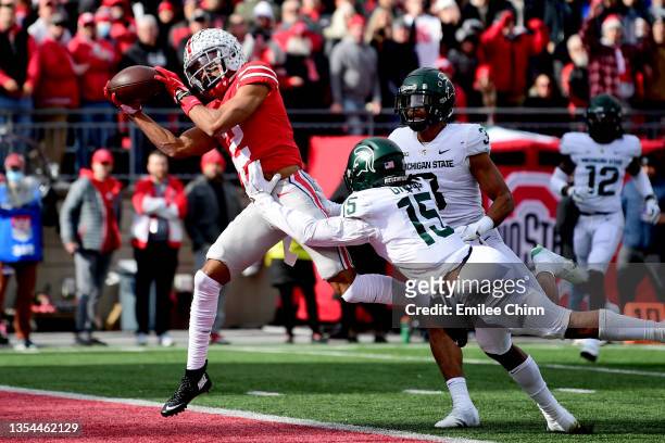 Chris Olave of the Ohio State Buckeyes catches a pass for a touchdown during the first half of a game against the Michigan State Spartans at Ohio...