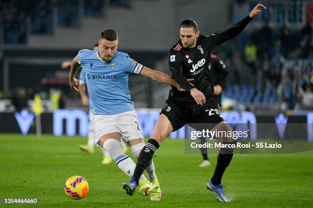 Sergej Milinkovic Savic of SS Lazio compete for the ball with Adrien Rabiot of Juventus during the Serie A match between SS Lazio and Juventus at...