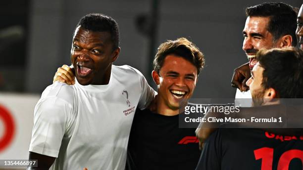Marcel Desailly, Juan Pablo Angel and Yaya Toure celebrate with Nyck de Vries of Netherlands and Mercedes GP and Pierre Gasly of France and Scuderia...