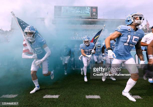 The North Carolina Tar Heels take the field for their game against the Wofford Terriers at Kenan Memorial Stadium on November 20, 2021 in Chapel...