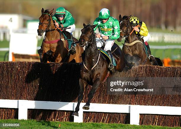Sam Twiston-Davies riding Astracad clear the last to win The Jenny Mould Memorial Handicap Steple Chase at Cheltenham racecourse on December 10, 2011...