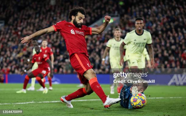 Mohamed Salah of Liverpool shoots at goal past Aaron Ramsdale of Arsenal but misses during the Premier League match between Liverpool and Arsenal at...