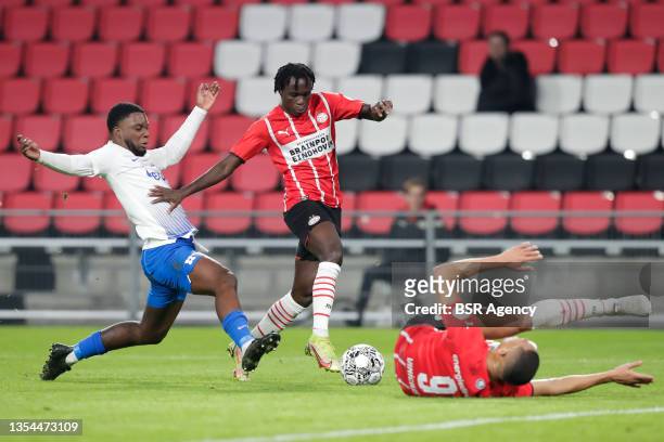 Riechedly Bazoer of Vitesse fouls Bruma of PSV during the Dutch Eredivisie match between PSV and Vitesse at the Philips Stadion on November 20, 2021...
