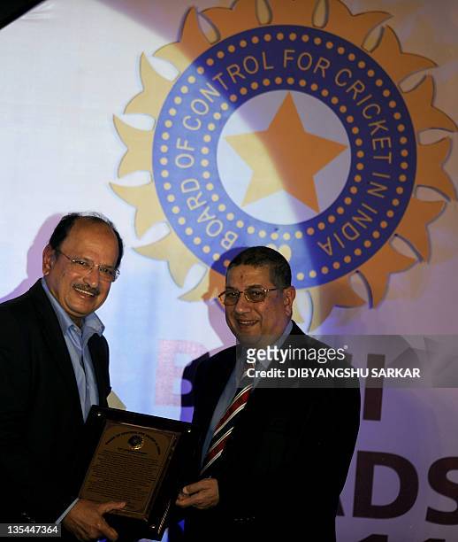 The president of Board of Control for Cricket in India N.Srinivasan presents the life time achievement award to former Indian cricket captain Ajit...