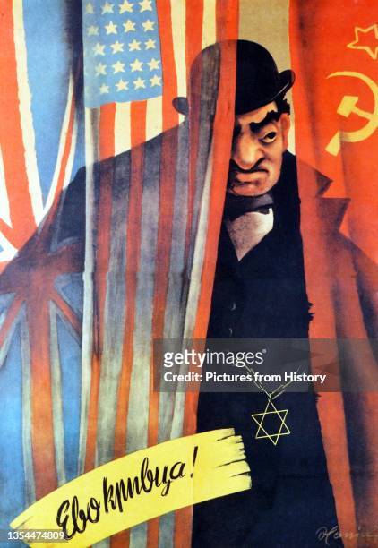 Poster with an illustration in colour of a Jew hiding behind a curtain with the flags of USSR, USA and UK. On the lower part the caption 'culprit' is...