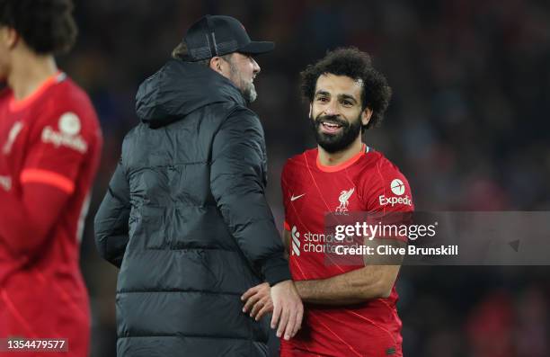 Mohamed Salah embraces Juergen Klopp, Manager of Liverpool after their sides victory in the Premier League match between Liverpool and Arsenal at...