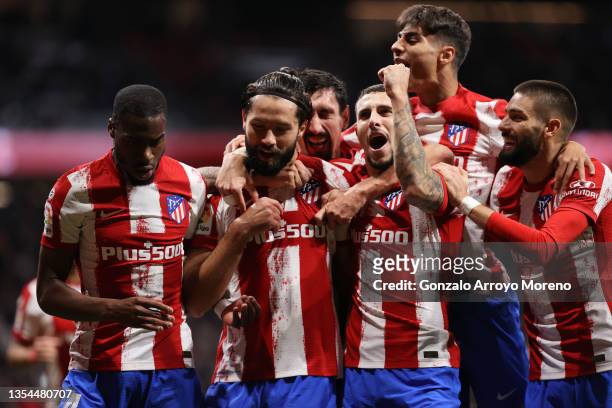 Felipe Almeida of Atletico de Madrid celebrates scoring their opening goal with teammates Geoffrey Kondogbia , Stefan Savic , Mario Hermoso and...
