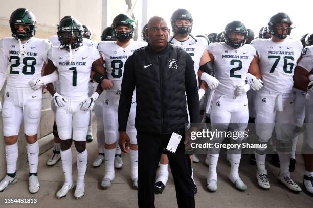 Head coach Mel Tucker of the Michigan State Spartans waits walks with his players to the field to play the Ohio State Buckeyes at Ohio Stadium on...