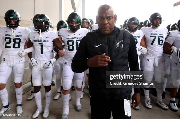 Head coach Mel Tucker of the Michigan State Spartans waits walks with his players to the field to play the Ohio State Buckeyes at Ohio Stadium on...