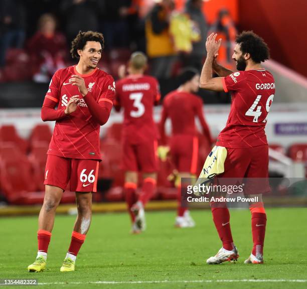 Trent Alexander-Arnold of Liverpool with Mohamed Salah of Liverpool at the end of the Premier League match between Liverpool and Arsenal at Anfield...