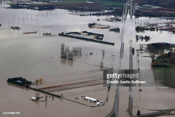 In an aerial view, floodwaters cover a section of highway 1 on November 20, 2021 in Abbotsford, British Columbia. The Canadian province of British...