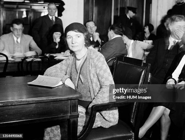 Margaret Sanger, proponent of the eugenics movement, sitting at a conference table circa 1931.