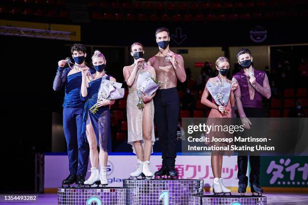 Piper Gilles and Paul Poirier of Canada, Gabriella Papadakis and Guillaume Cizeron of France and Alexandra Stepanova and Ivan Bukin of Russia pose in...