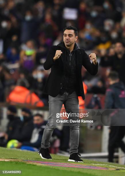 Xavi Hernandez, Head Coach of FC Barcelona celebrates their team's first goal during the La Liga Santander match between FC Barcelona and RCD...