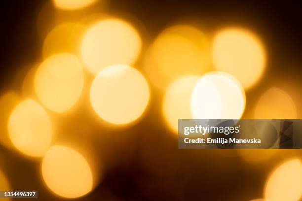 gold  bokeh background - first light awards stock-fotos und bilder