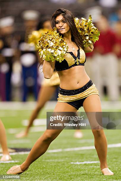 Cheerleaders of the New Orleans Saints perform during a game against the Detroit Lions at Mercedes-Benz Superdome on December 4, 2011 in New Orleans,...