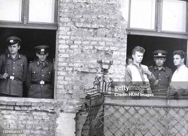 Berlin Wall Photo - 10/3/1961 - The Windows Up to the 4th Level of the Evacuated Houses at Bernauer Strasse Are Cemented Shut Under Supervision of...